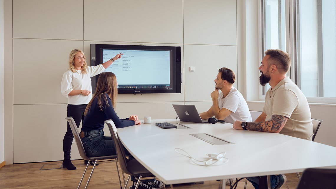 A corporate presentation given by a woman working for TGW Logistics