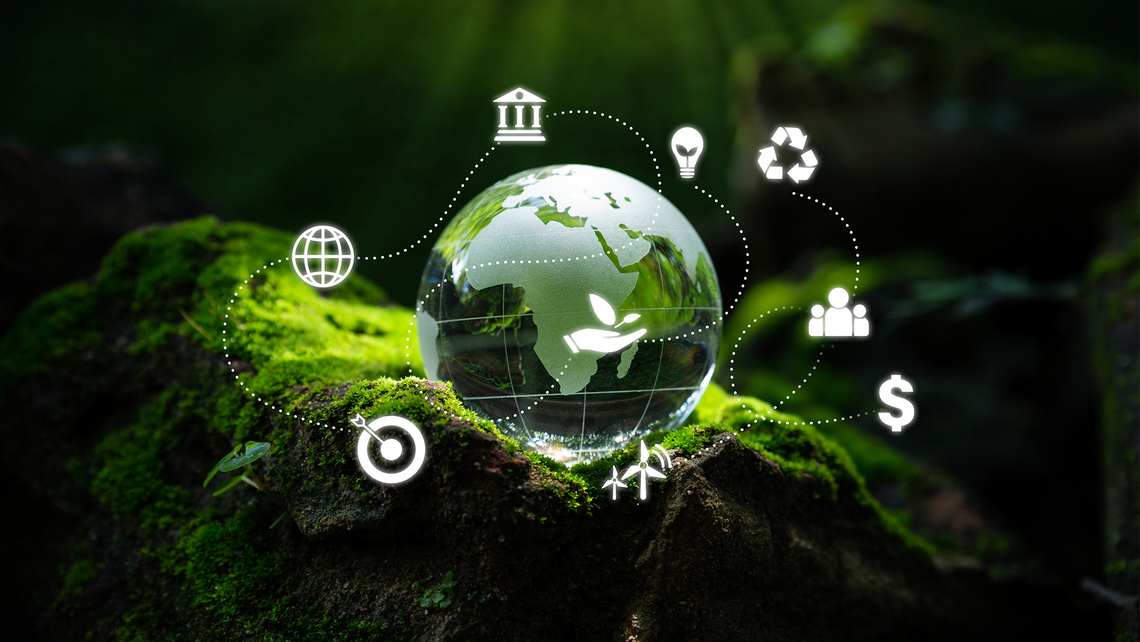 Image of a globe nestled inside a mossy forest scene. Icons representing a holistic idea of sustainability and sustainable logistics surround the globe.