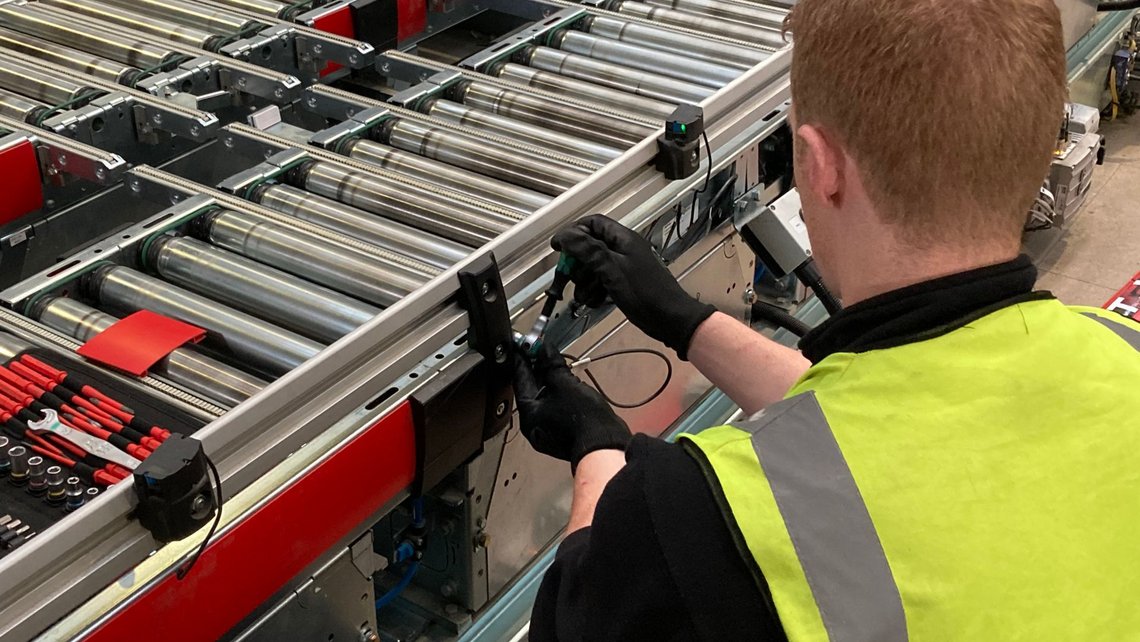 A logistics engineer working on an intralogistics system